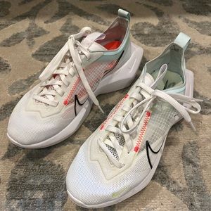 Transparent Nike sneaker with pop accent colors.